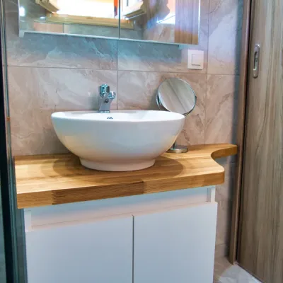 Bathroom vanity with vessel sink and walk-in shower, two-bedroom apartment, Tria Adelphia